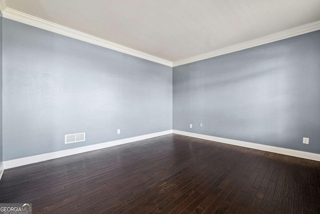 unfurnished room with ornamental molding and dark hardwood / wood-style floors