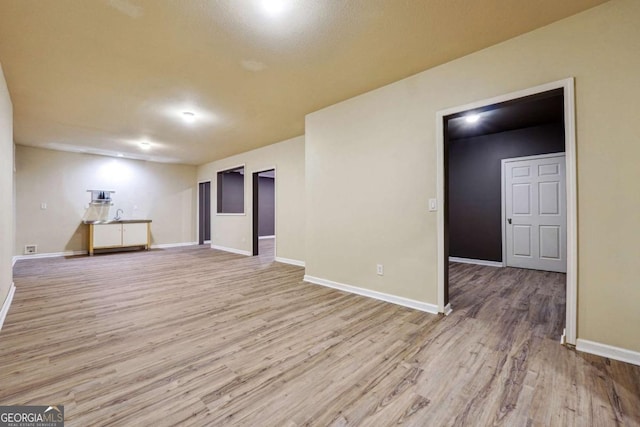 unfurnished room with light hardwood / wood-style floors