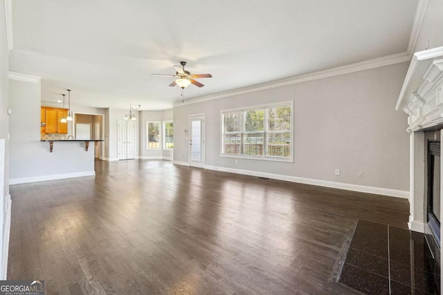 unfurnished living room featuring ceiling fan, ornamental molding, and dark hardwood / wood-style floors