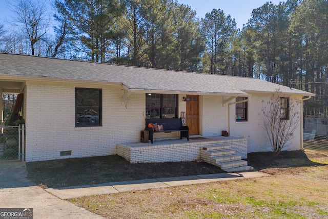 ranch-style home featuring a porch