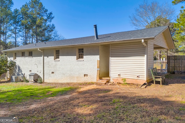 back of house featuring cooling unit