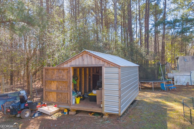 view of outbuilding featuring a trampoline