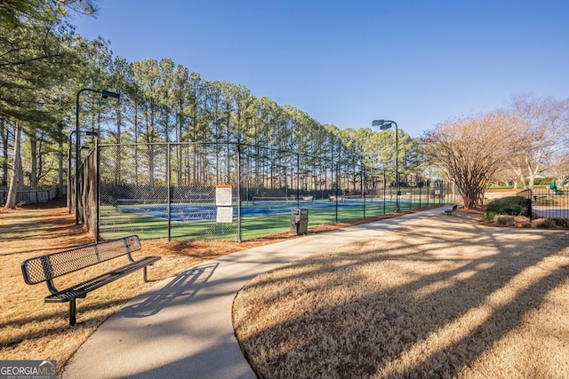 surrounding community featuring tennis court