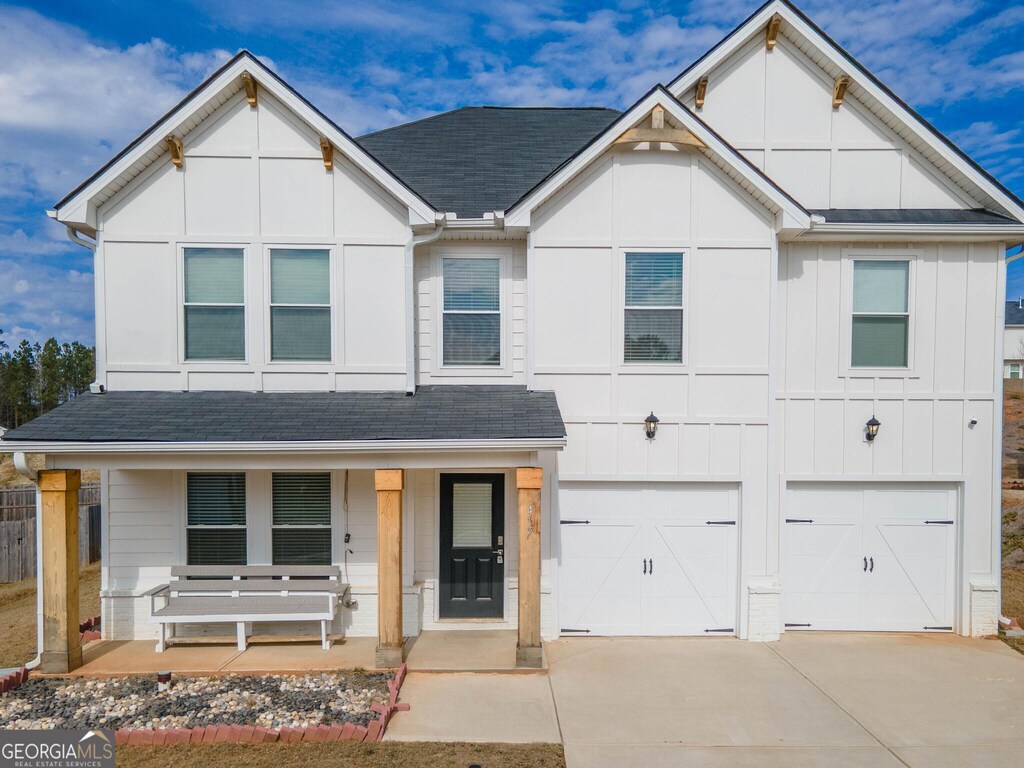 view of front of house with a garage and covered porch