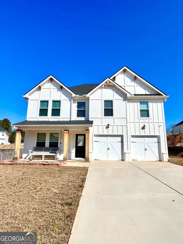 view of front of house with a garage and covered porch