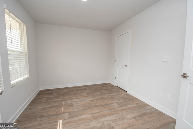 spare room featuring light wood-type flooring