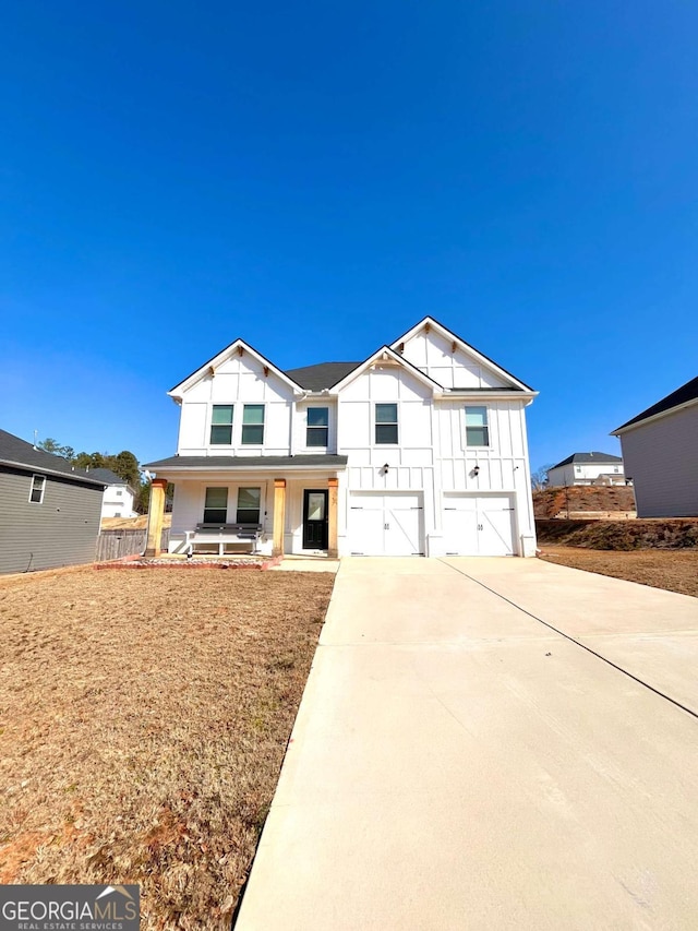 view of front of home featuring a garage and covered porch