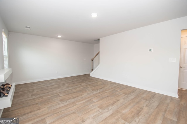 spare room featuring light wood-type flooring