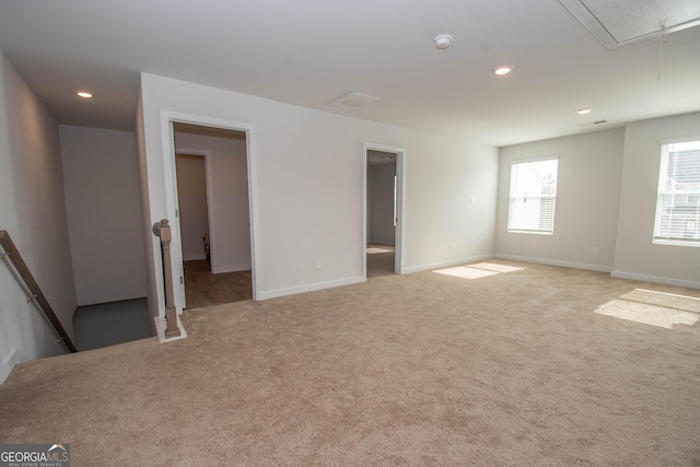 empty room featuring light carpet