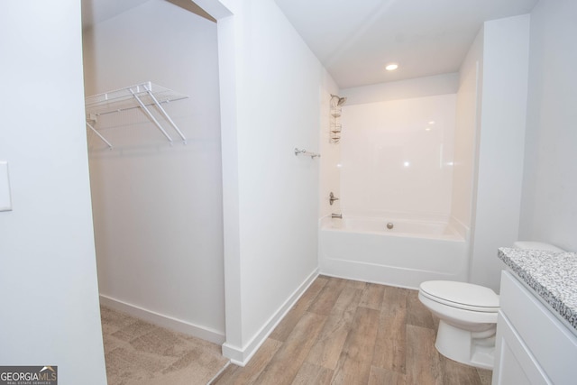 full bathroom featuring shower / bathtub combination, vanity, toilet, and hardwood / wood-style floors