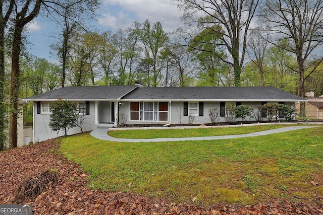 ranch-style home with a front lawn