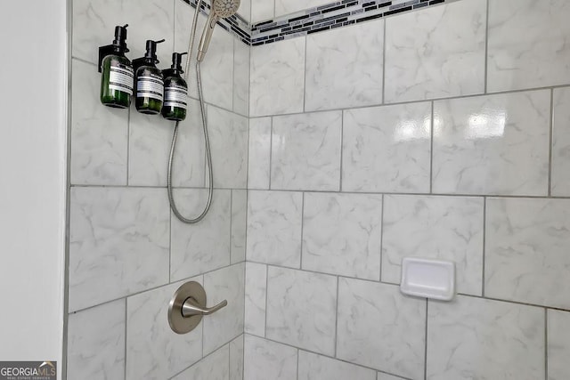 details featuring a tile shower