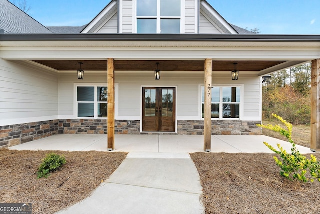 entrance to property with french doors and covered porch