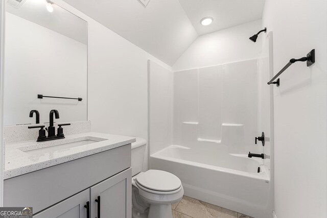 full bathroom with vanity, lofted ceiling, shower / bathtub combination, and toilet