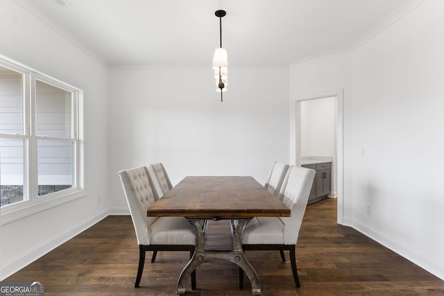 dining room featuring crown molding and dark hardwood / wood-style flooring