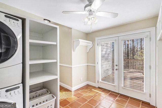 laundry room featuring french doors, ceiling fan, and stacked washer / drying machine