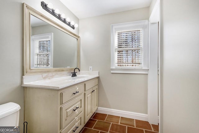 bathroom with vanity and toilet