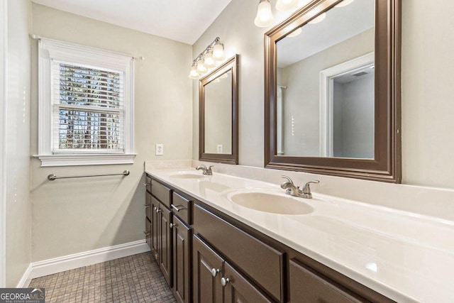 bathroom with tile patterned floors and vanity