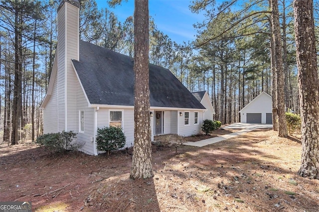 view of front of home featuring an outbuilding and a garage