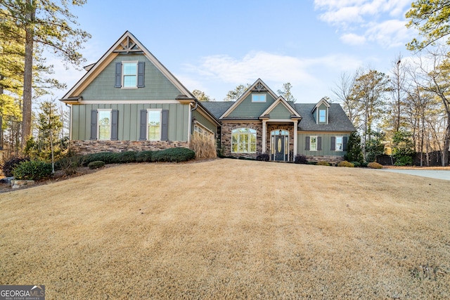 craftsman-style home with a front lawn