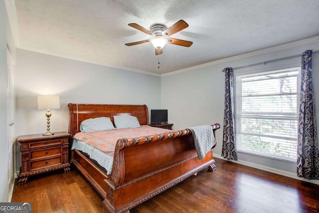 bedroom featuring dark wood-type flooring, ornamental molding, multiple windows, and a textured ceiling