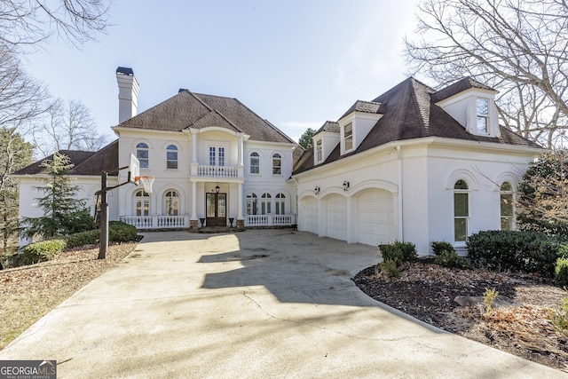 view of front of house featuring french doors and a garage