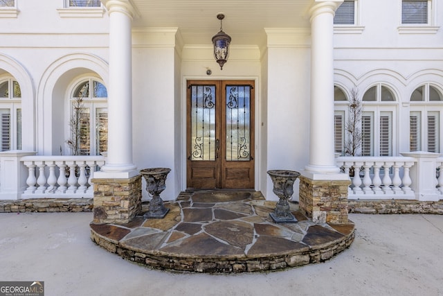 view of exterior entry featuring french doors