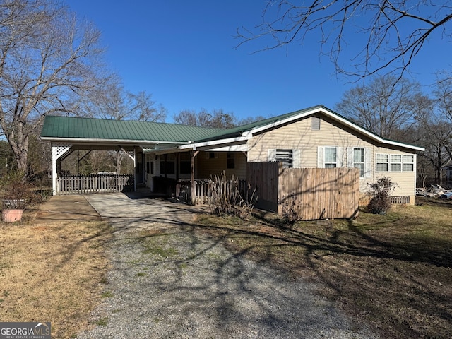 view of home's exterior featuring a carport