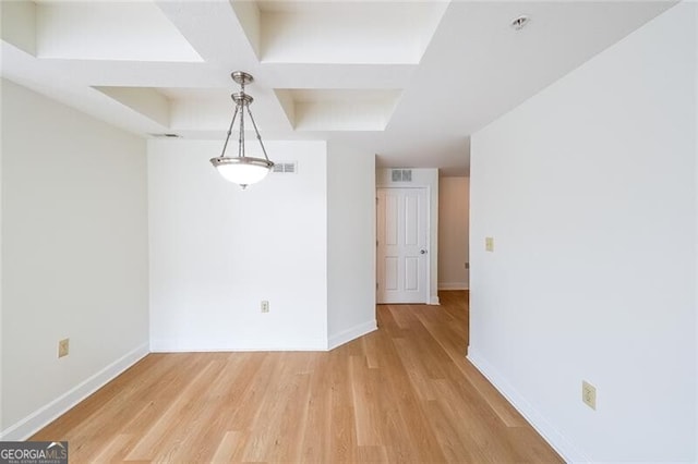 empty room featuring hardwood / wood-style flooring