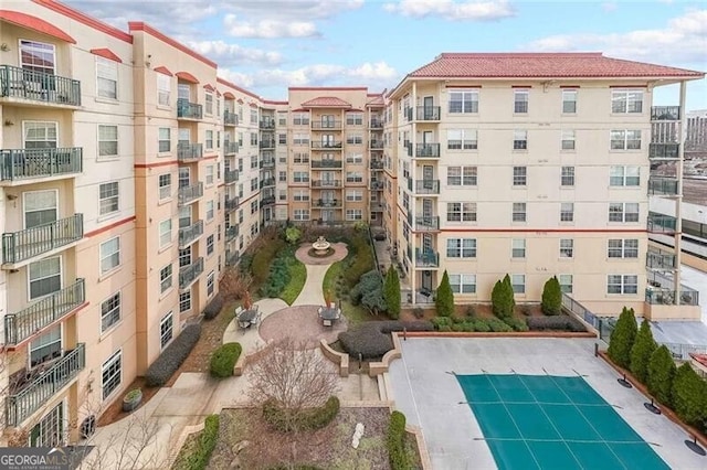 view of building exterior with a community pool