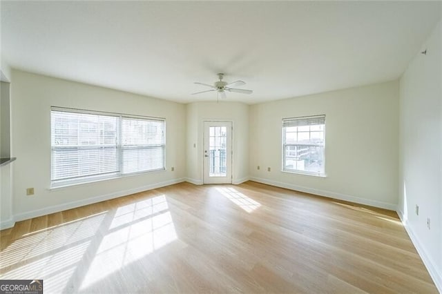 unfurnished room with light hardwood / wood-style flooring and ceiling fan