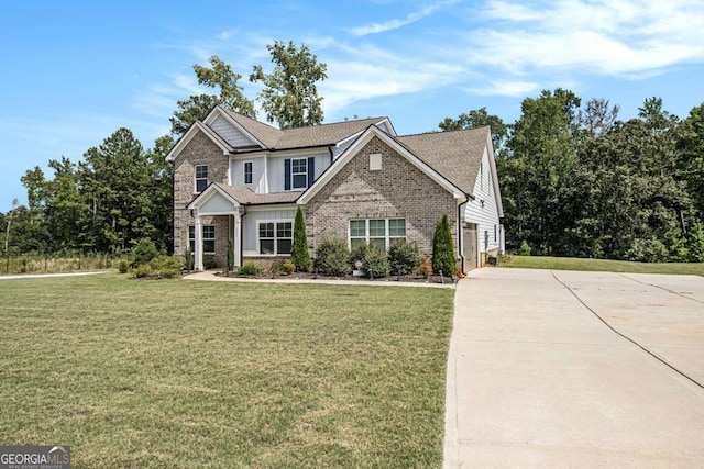 view of front of home with a garage and a front lawn