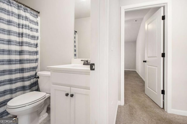 bathroom with vanity, a shower with curtain, and toilet