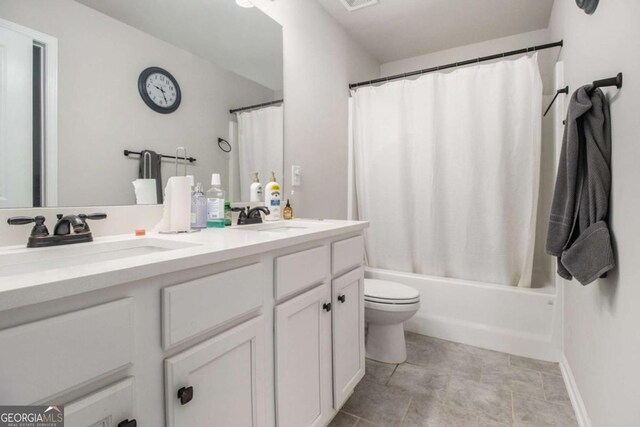 full bathroom featuring vanity, toilet, and shower / bath combo with shower curtain