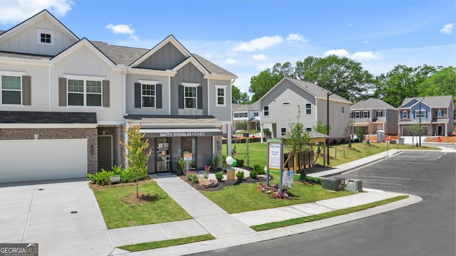 view of front of home featuring a garage and a front lawn