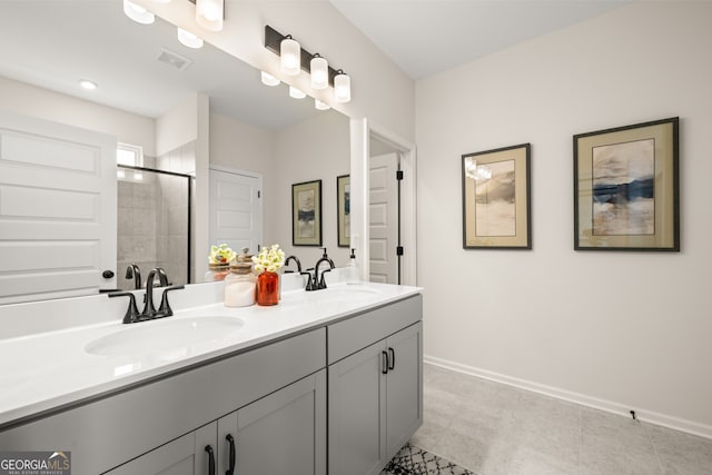 bathroom with vanity and a tile shower