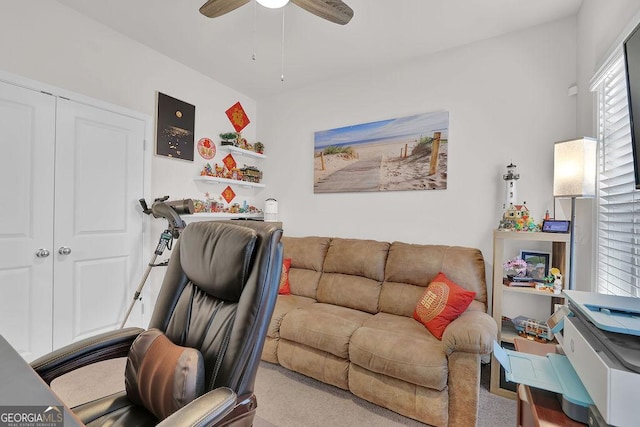 office area featuring ceiling fan and light carpet