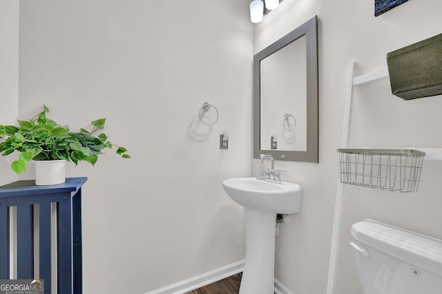 bathroom with sink and toilet