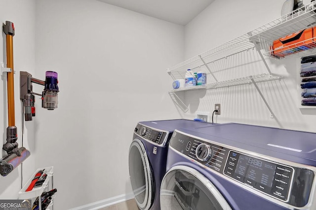 laundry room with independent washer and dryer