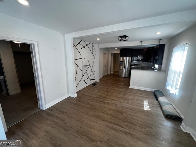 unfurnished living room with dark hardwood / wood-style flooring