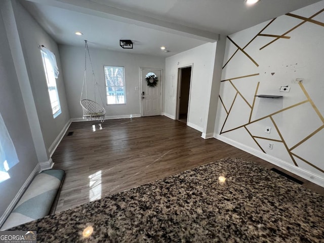 foyer with dark hardwood / wood-style floors