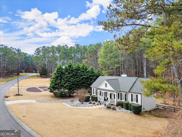 view of front facade with a front lawn and covered porch