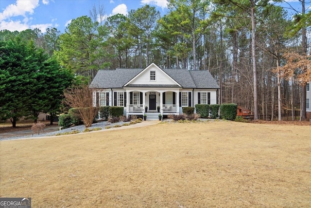 view of front of house with a front yard and covered porch