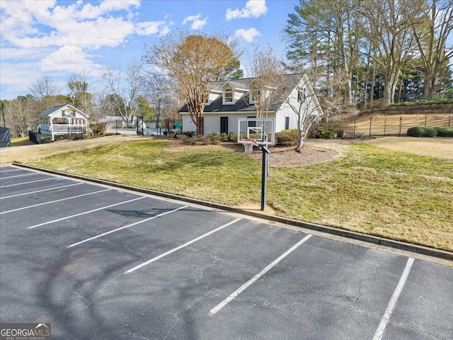 view of car parking with a lawn