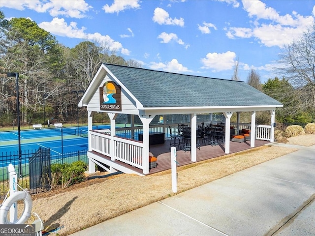 view of home's community featuring a gazebo and tennis court