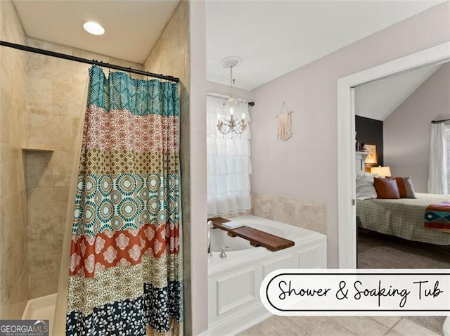 bathroom featuring lofted ceiling, plus walk in shower, and a chandelier