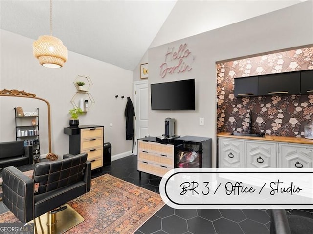 tiled living room with vaulted ceiling