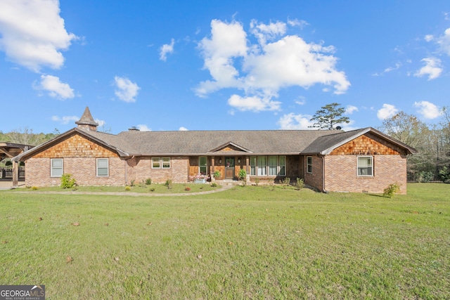 single story home with a front lawn