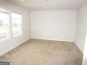 empty room featuring carpet flooring