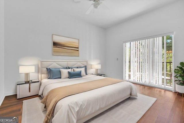 bedroom featuring dark hardwood / wood-style flooring, access to exterior, and ceiling fan